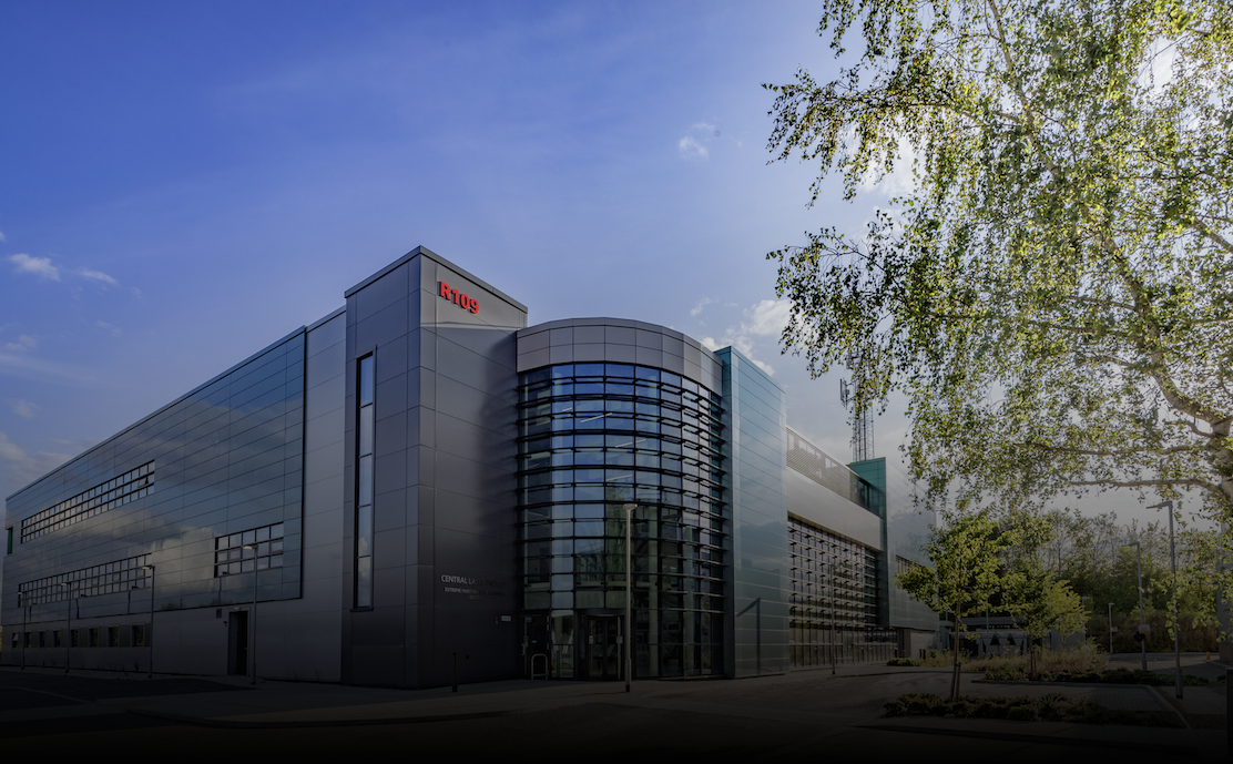 External shot of the EPAC building, which is a large modern 3 storey building with large curved window frontage. The rest of the building is clad in a mix of green and grey tile.